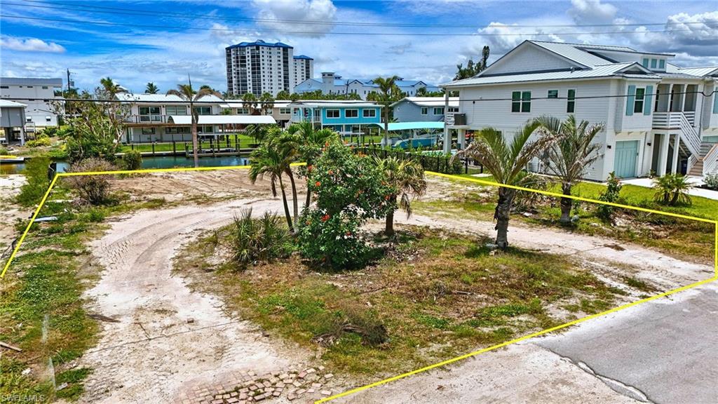 21730 Madera Road Fort Myers Beach, FL 33931 - Photo 12 of 14 a view of a house with backyard porch and sitting area