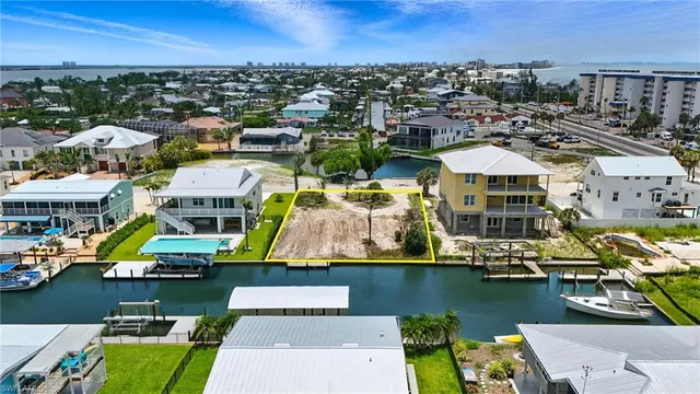 an aerial view of a houses with a lake view