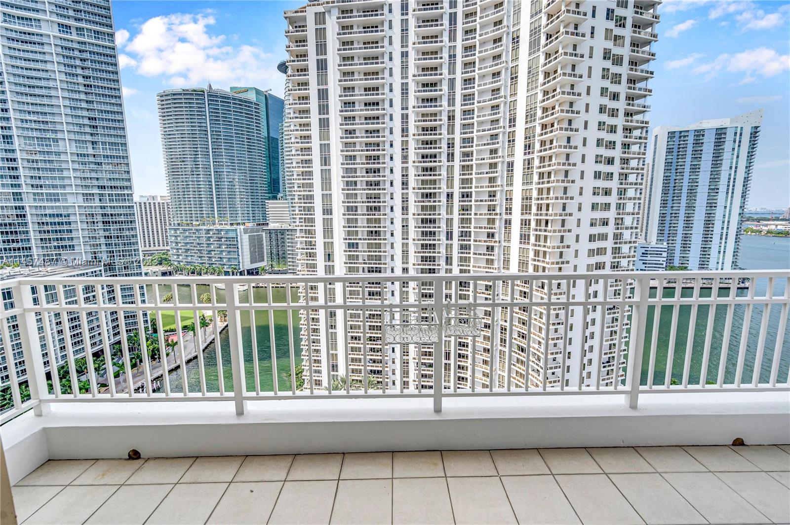 a view of a balcony with a floor to ceiling window