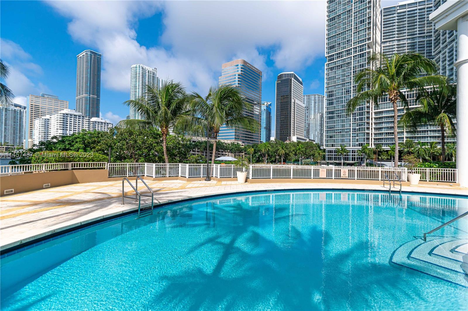 801 Brickell Key Boulevard, Unit 2208 Miami, FL 33131 - Photo 18 of 22 a view of a house with a swimming pool