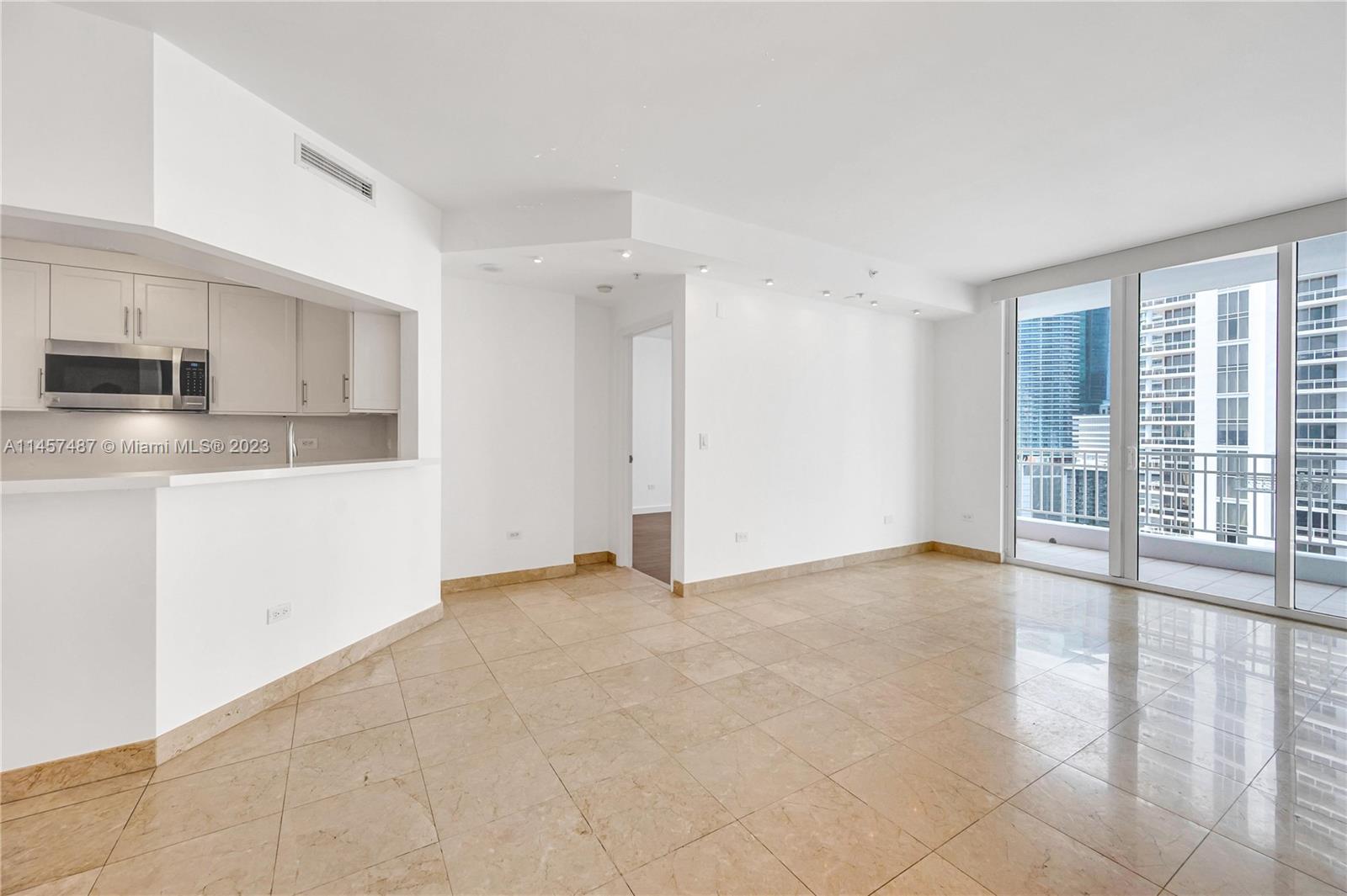 801 Brickell Key Boulevard, Unit 2208 Miami, FL 33131 - Photo 6 of 22 a view of a kitchen with a sink and a window