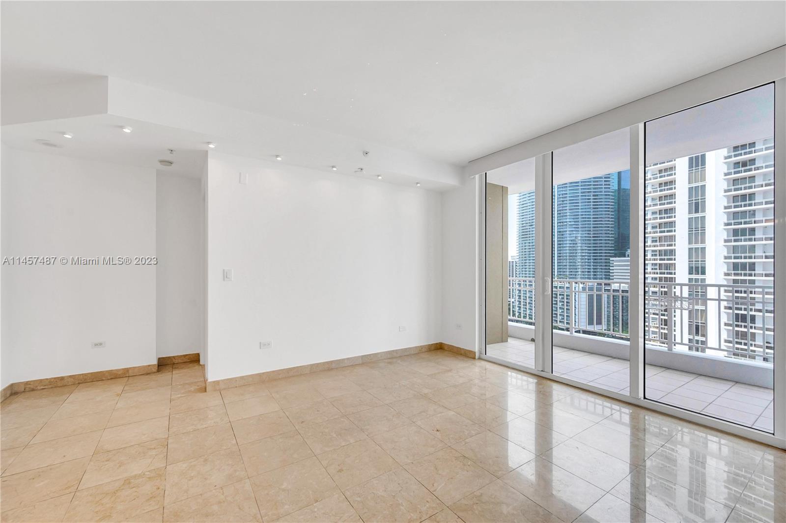 801 Brickell Key Boulevard, Unit 2208 Miami, FL 33131 - Photo 9 of 22 a view of an empty room with a window