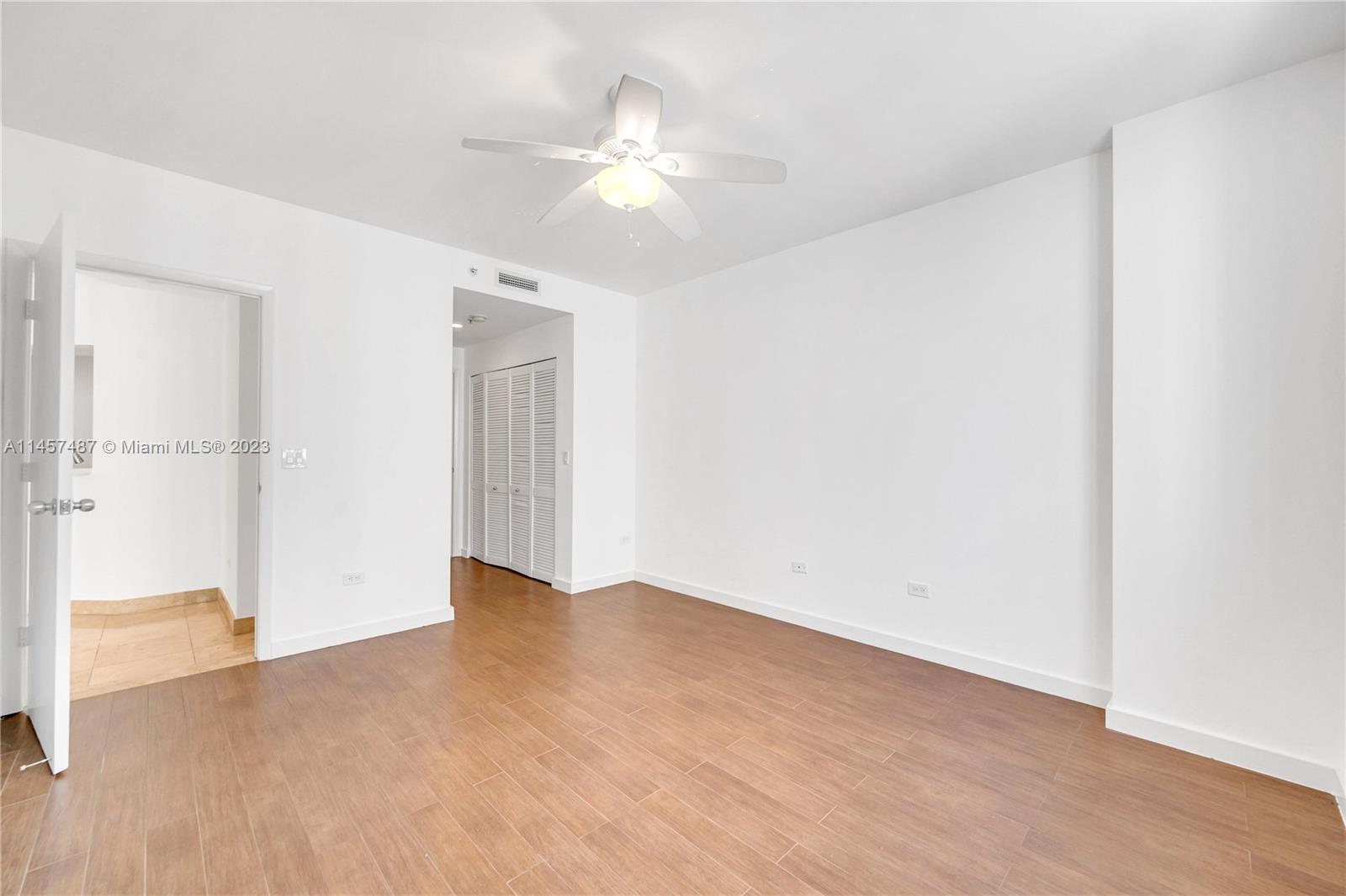 801 Brickell Key Boulevard, Unit 2208 Miami, FL 33131 - Photo 10 of 22 wooden floor in an empty room