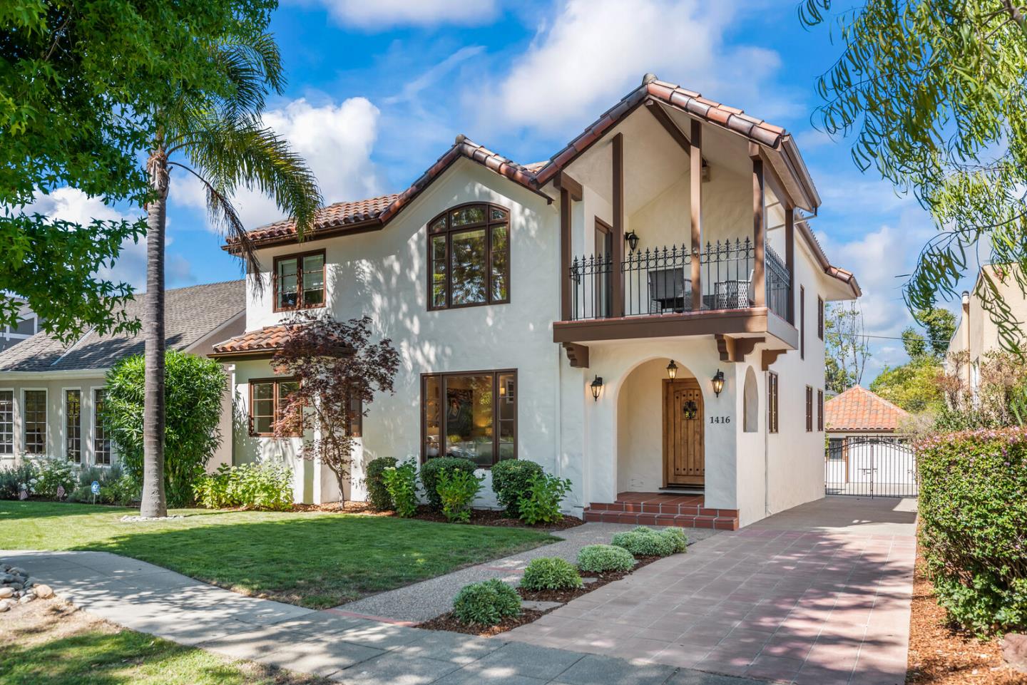 1416 Columbus Avenue Burlingame, CA 94010 - Photo 1 of 39 a front view of a house with a garden