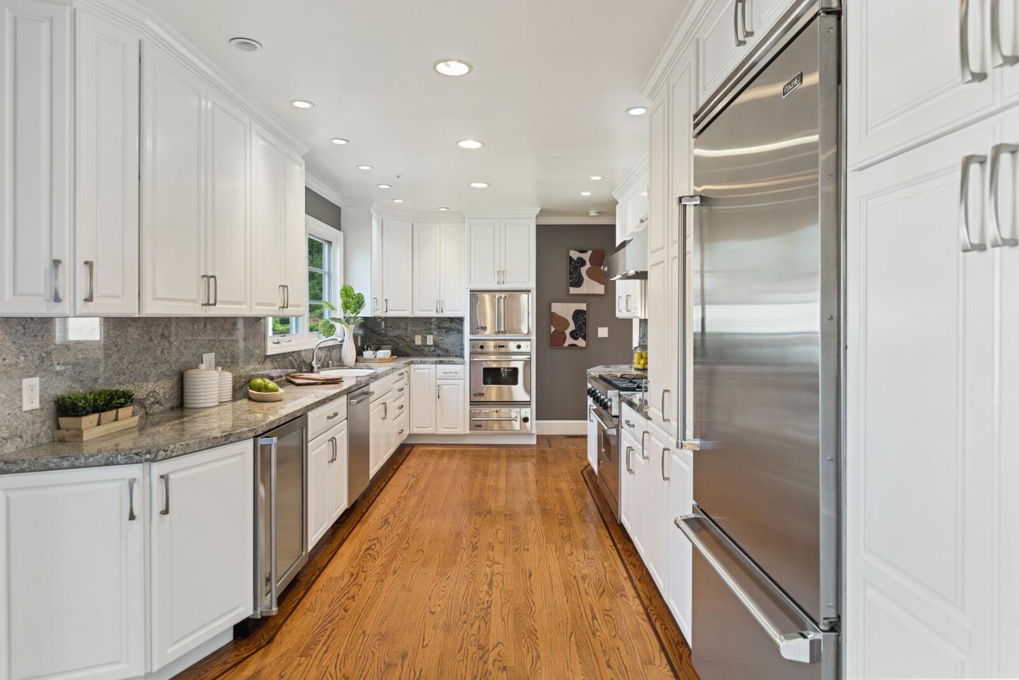 1416 Columbus Avenue Burlingame, CA 94010 - Photo 11 of 39 a large kitchen with a refrigerator a sink a stove and cabinets