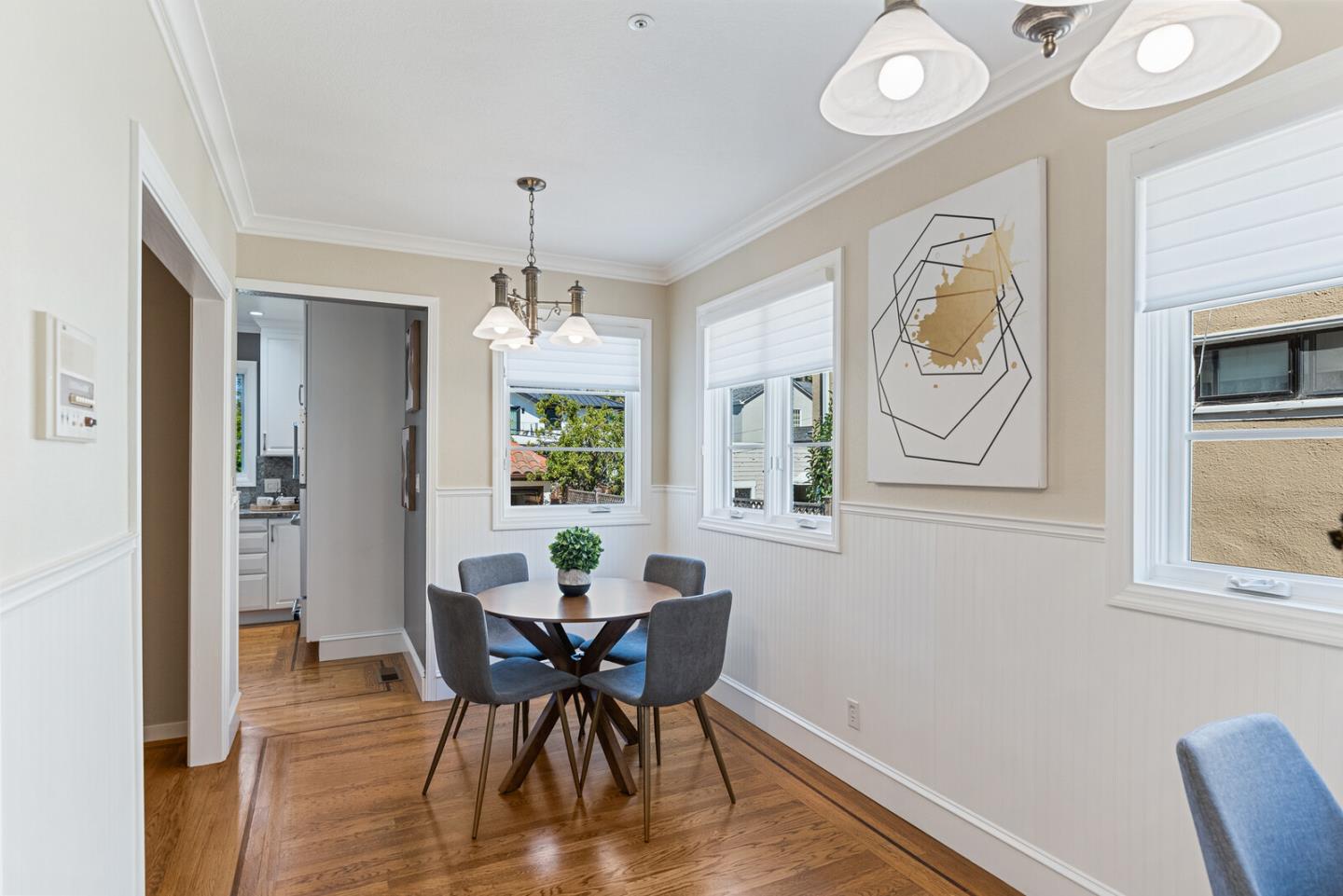 1416 Columbus Avenue Burlingame, CA 94010 - Photo 15 of 39 a dining room with furniture a window and wooden floor