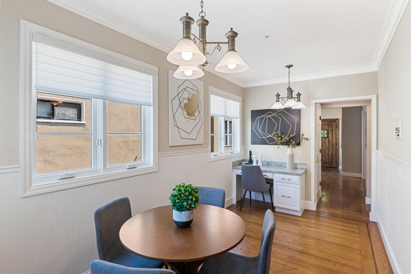 1416 Columbus Avenue Burlingame, CA 94010 - Photo 16 of 39 a dining room with furniture a potted plant and a chandelier