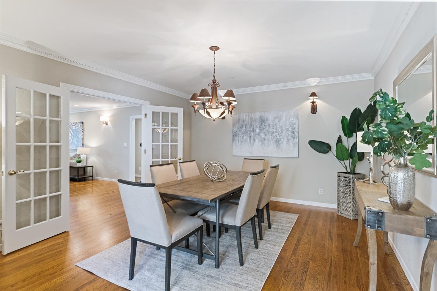 1416 Columbus Avenue Burlingame, CA 94010 - Photo 18 of 39 a dining room with furniture potted plants and wooden floor