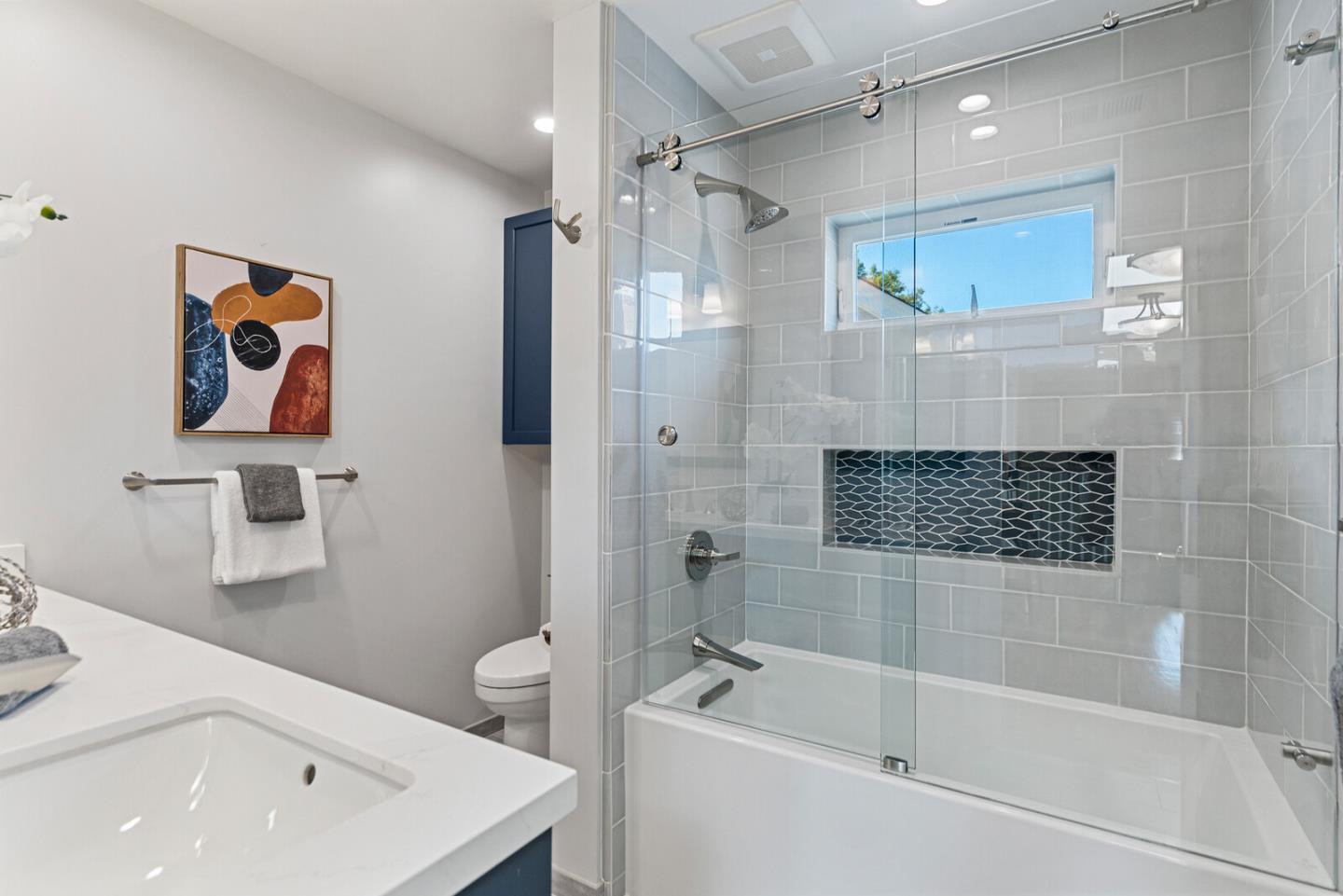 1416 Columbus Avenue Burlingame, CA 94010 - Photo 32 of 39 a bathroom with a shower a sink a toilet and shower