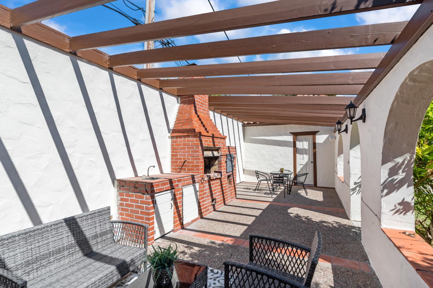1416 Columbus Avenue Burlingame, CA 94010 - Photo 38 of 39 a living room with furniture and a floor to ceiling window