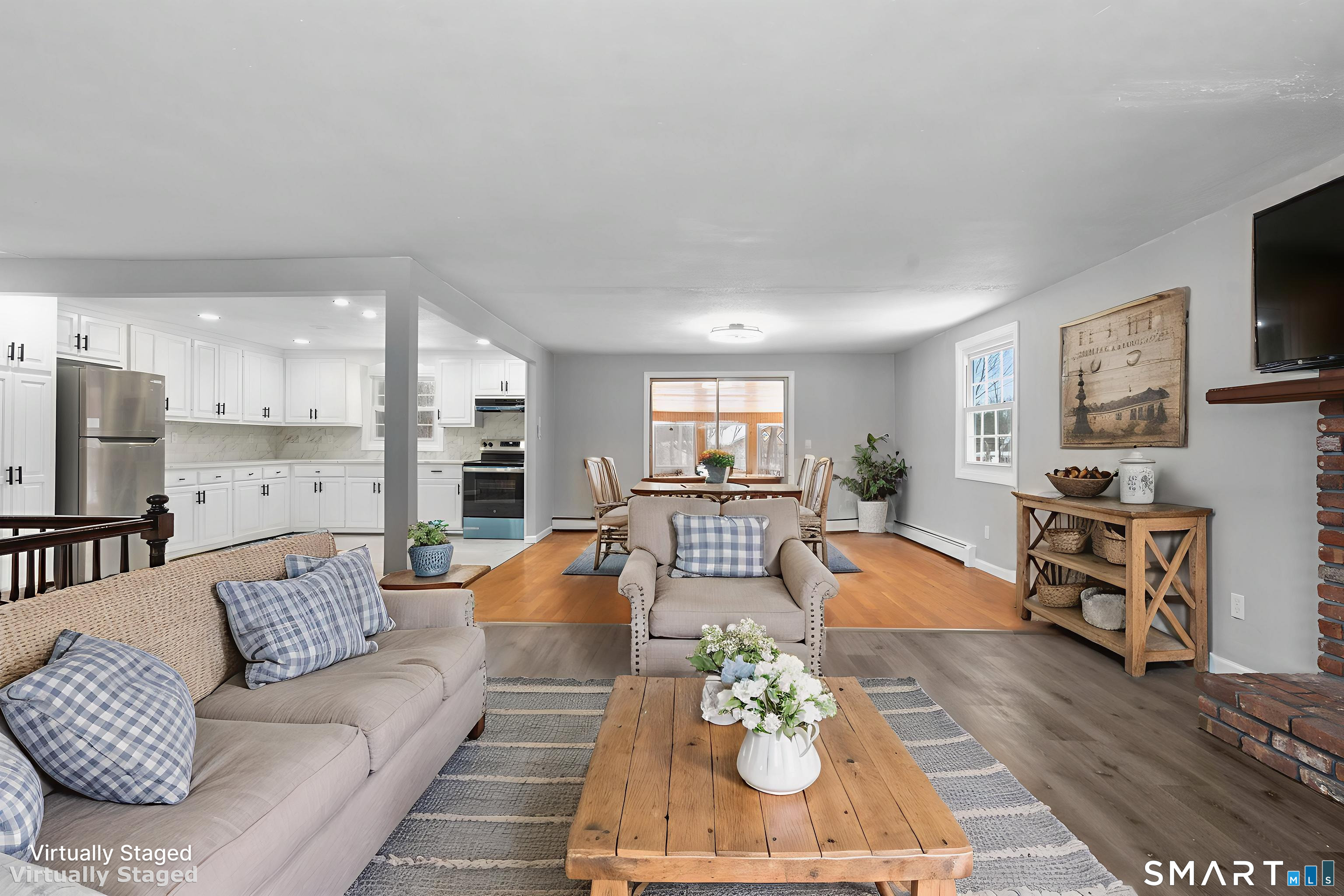 133 Phelps Road East Windsor, CT 06088 - Photo 13 of 40 a living room with furniture kitchen view and a flat screen tv