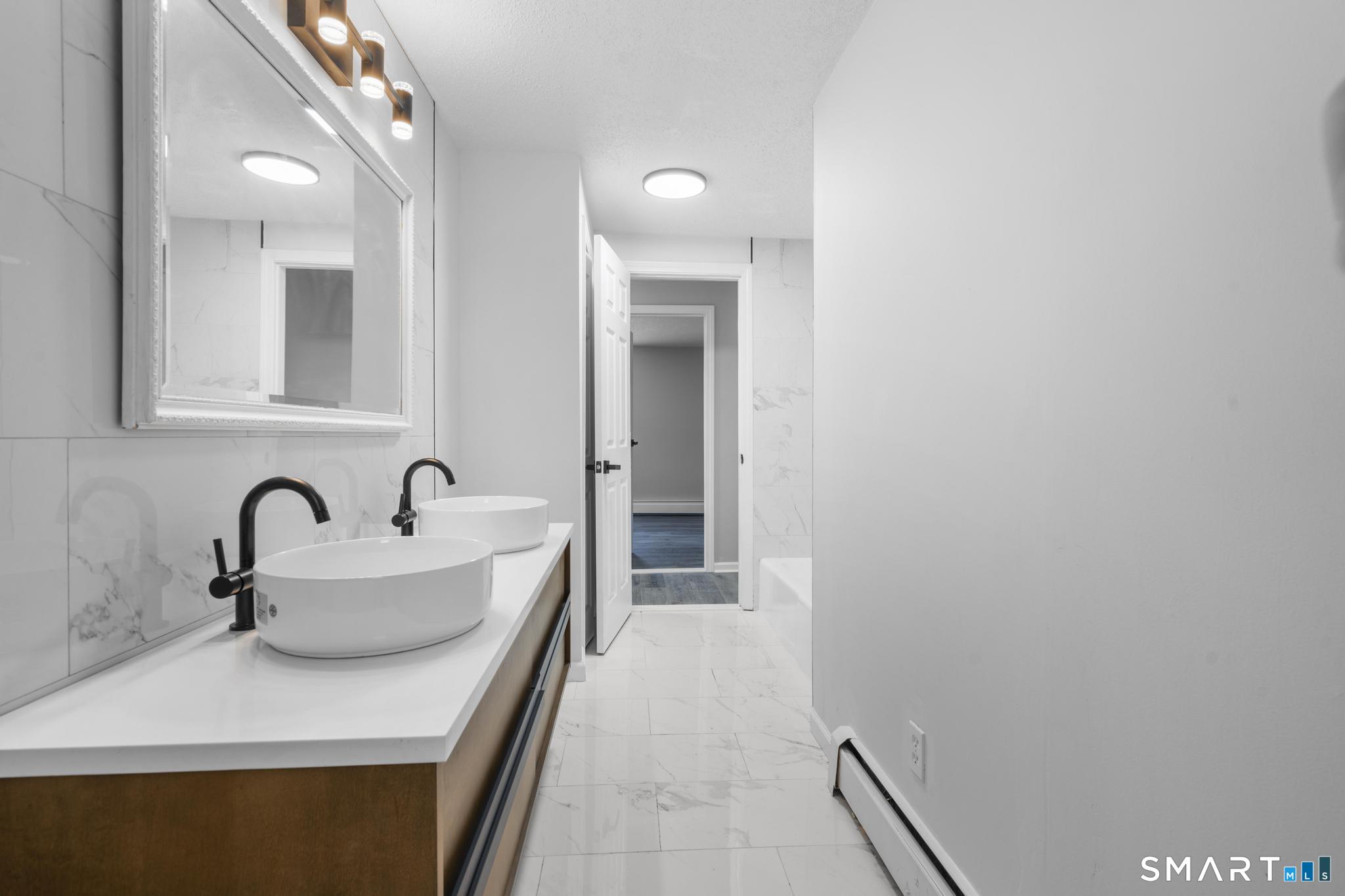 133 Phelps Road East Windsor, CT 06088 - Photo 18 of 40 a bathroom with a sink and a bathtub