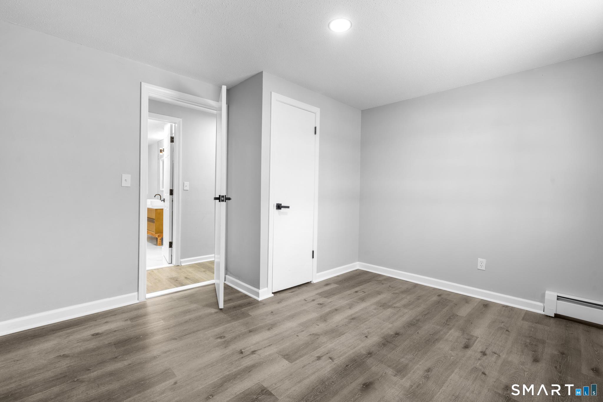 133 Phelps Road East Windsor, CT 06088 - Photo 19 of 40 a view of an empty room with wooden floor