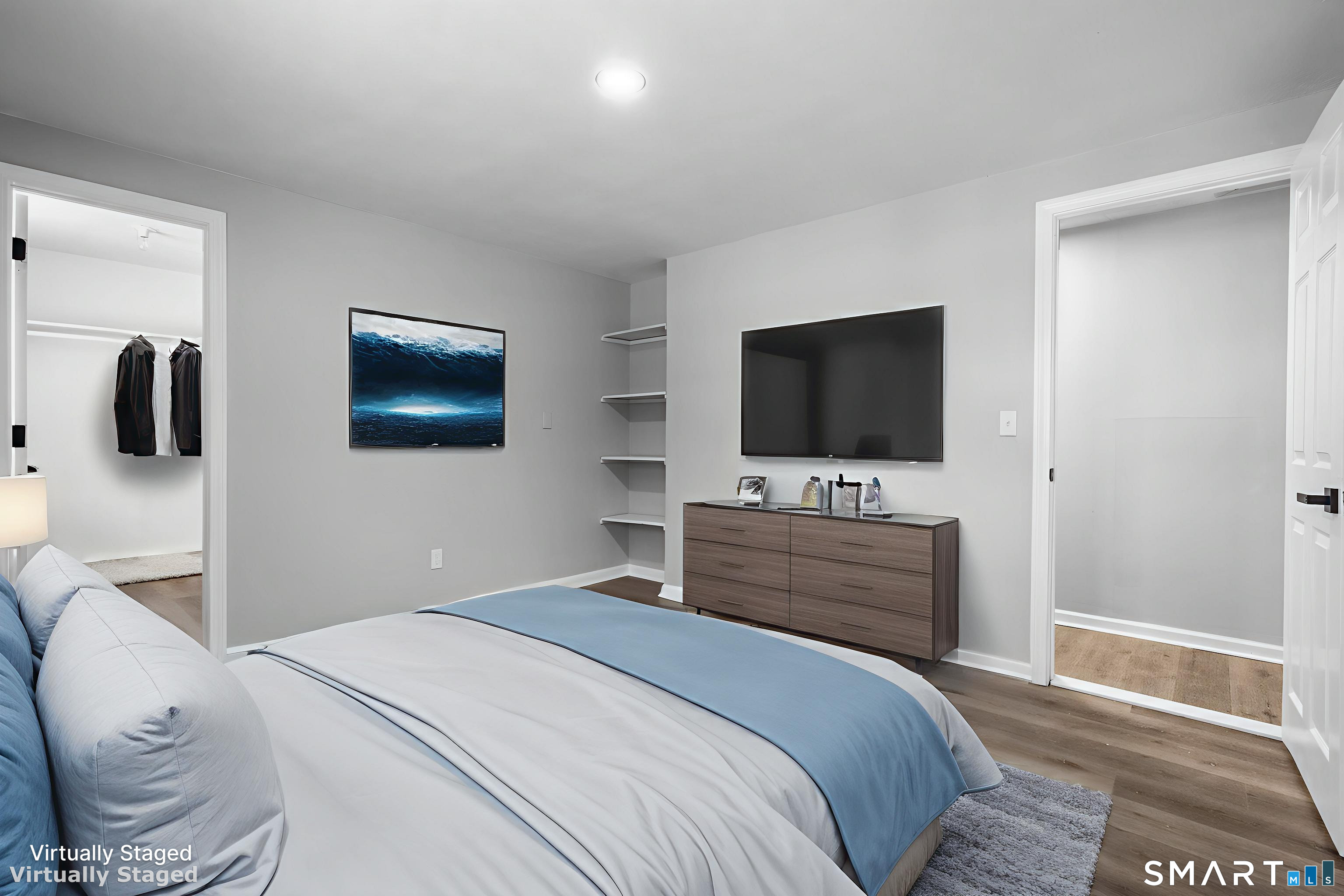 133 Phelps Road East Windsor, CT 06088 - Photo 23 of 40 a bedroom with a bed and a flat screen tv