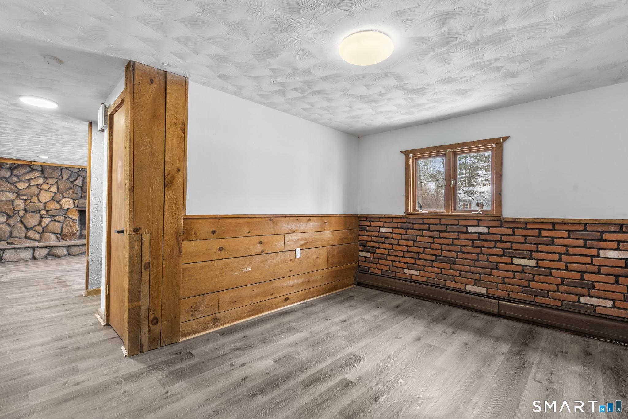 133 Phelps Road East Windsor, CT 06088 - Photo 35 of 40 a view of a room with wooden floor and cabinet