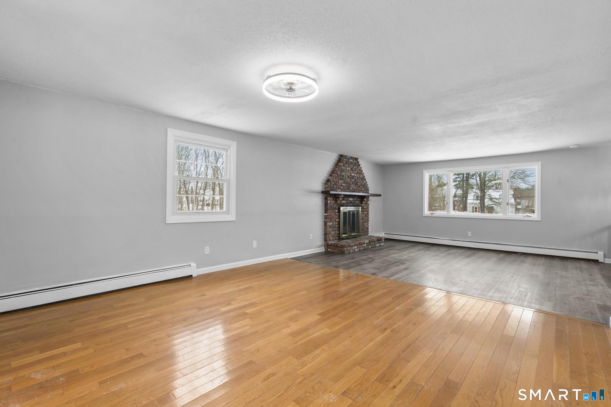 133 Phelps Road East Windsor, CT 06088 - Photo 10 of 40 wooden floor in an empty room with a window