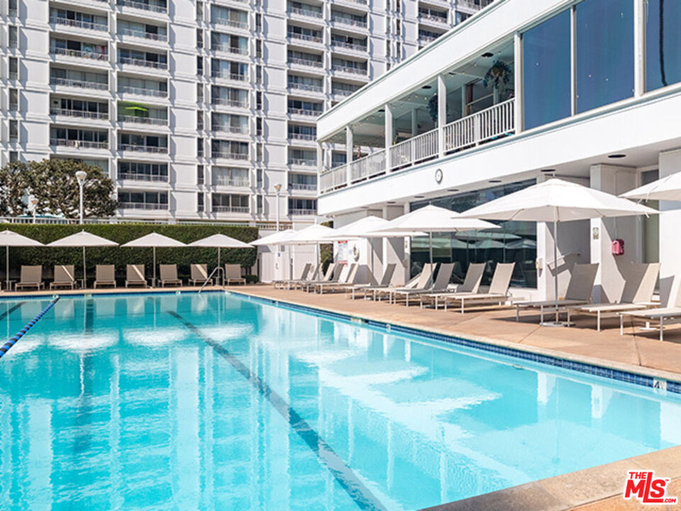 2700 Neilson Way, Unit 435 Santa Monica, CA 90405 - Photo 13 of 28 a view of a swimming pool with outdoor seating