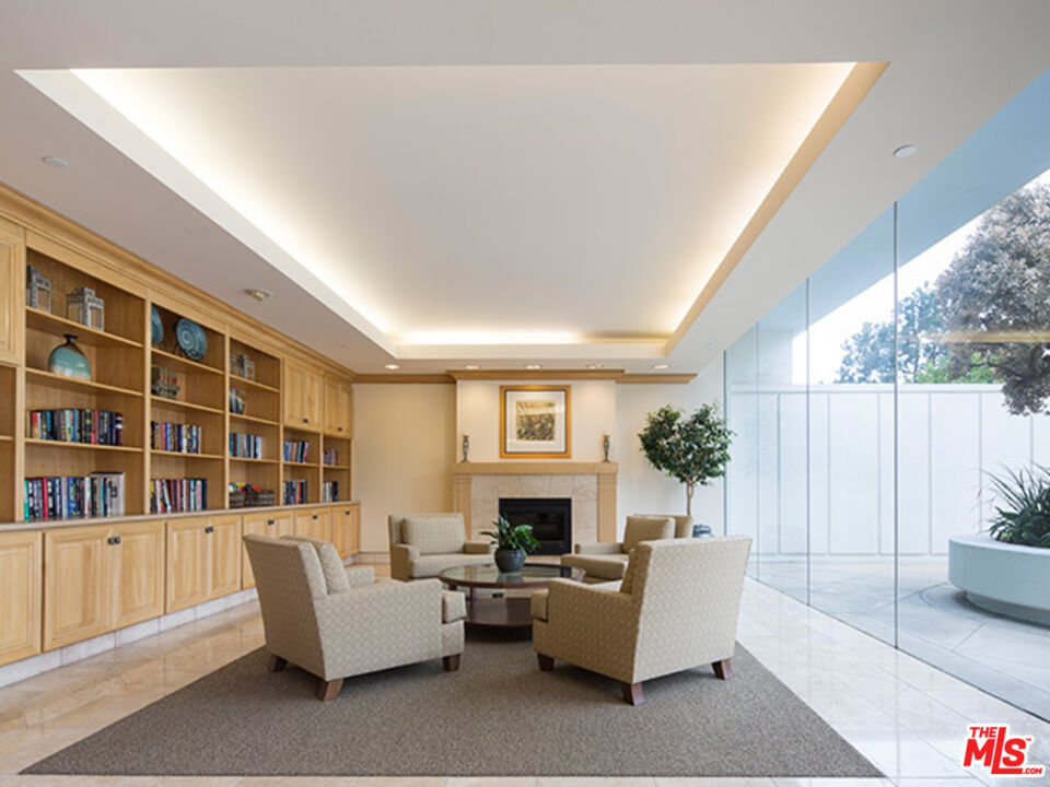 2700 Neilson Way, Unit 435 Santa Monica, CA 90405 - Photo 20 of 28 a living room with furniture and a fireplace