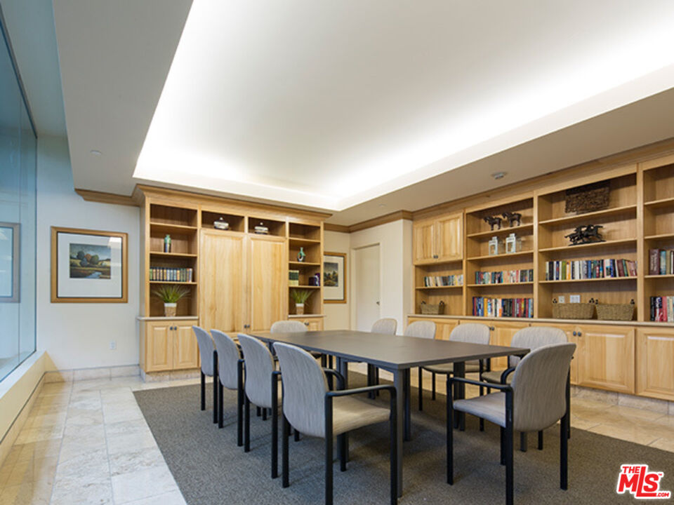 2700 Neilson Way, Unit 435 Santa Monica, CA 90405 - Photo 21 of 28 a dining room with a table and chairs