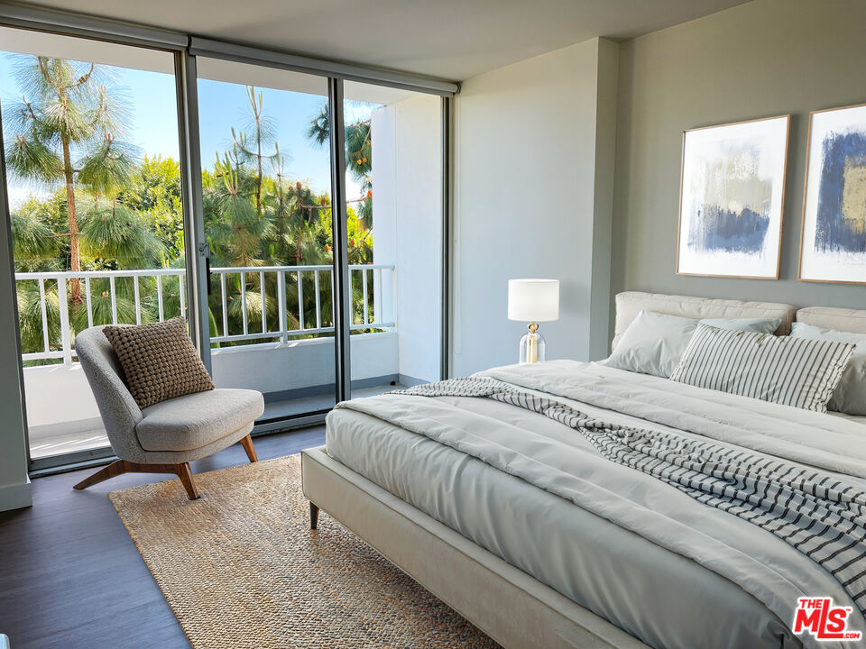 2700 Neilson Way, Unit 435 Santa Monica, CA 90405 - Photo 5 of 28 a bedroom with a bed and a large window