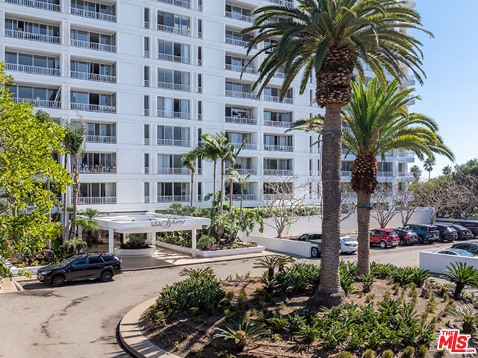 2700 Neilson Way, Unit 435 Santa Monica, CA 90405 - Photo 10 of 28 a view of a tall building with a yard and potted plants