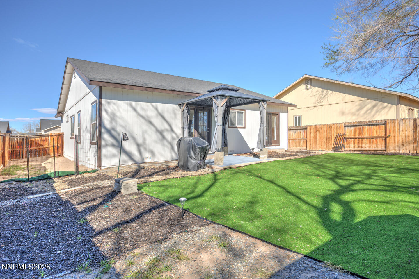 1284 Eider Circle Fallon, NV 89406 - Photo 16 of 21 a view of a house with backyard and porch