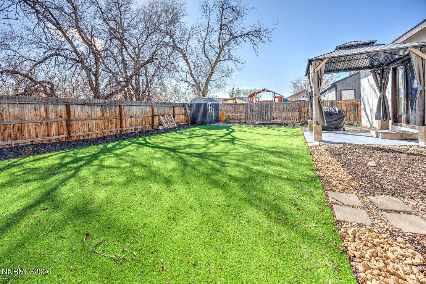 1284 Eider Circle Fallon, NV 89406 - Photo 18 of 21 a view of a house with backyard and a garden