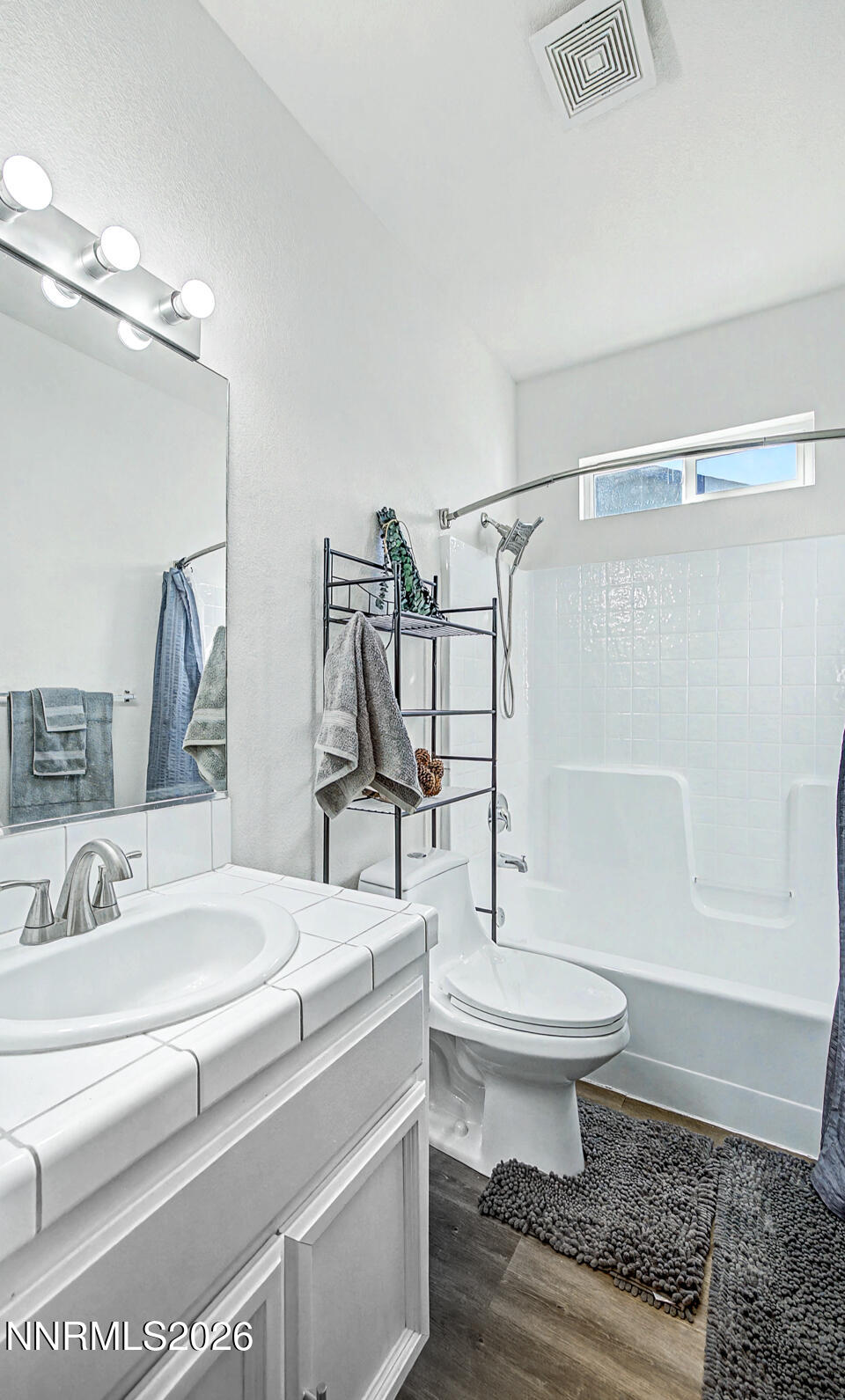1284 Eider Circle Fallon, NV 89406 - Photo 6 of 21 a bathroom with a sink toilet a mirror and shower