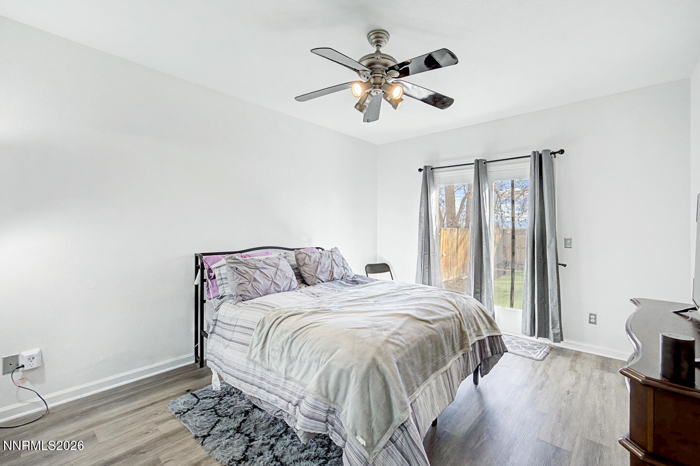 1284 Eider Circle Fallon, NV 89406 - Photo 8 of 21 a bedroom with a bed and a chandelier