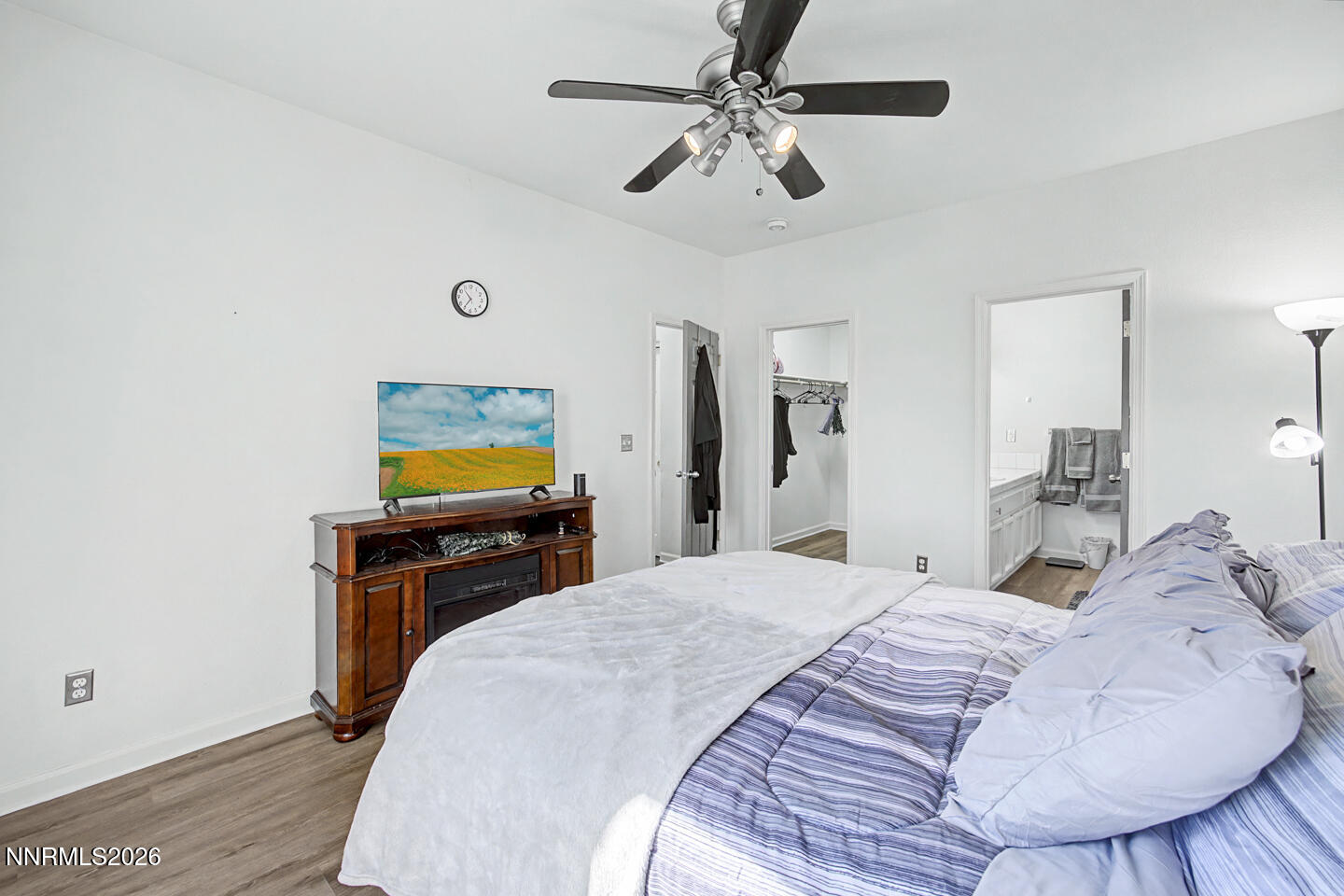 1284 Eider Circle Fallon, NV 89406 - Photo 9 of 21 a bedroom with a bed and a chandelier