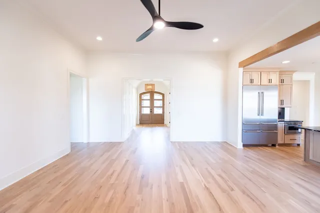 a kitchen with kitchen island granite countertop a stove and a sink