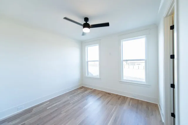 a bathroom with a double vanity sink mirror double and bathtub