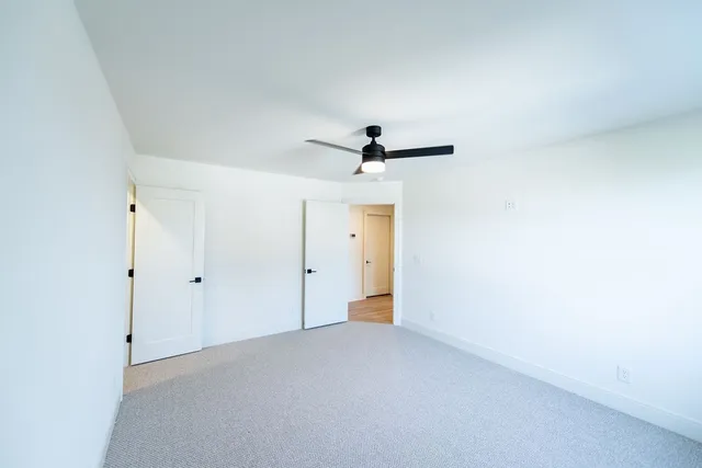 a view of an empty room with a large window