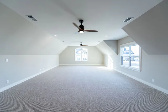 a view of an empty room with a large window