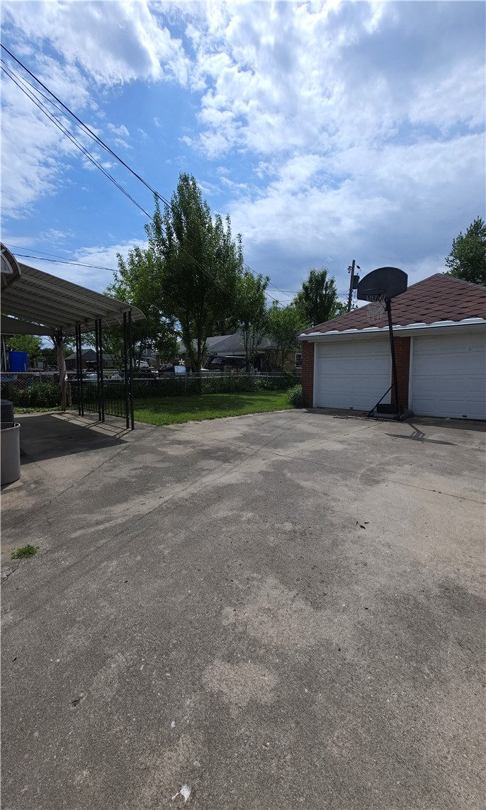 3109 Shroyer Road Kettering, OH 45429 - Photo 20 of 25 This property features a spacious concrete driveway leading to a two-car garage.