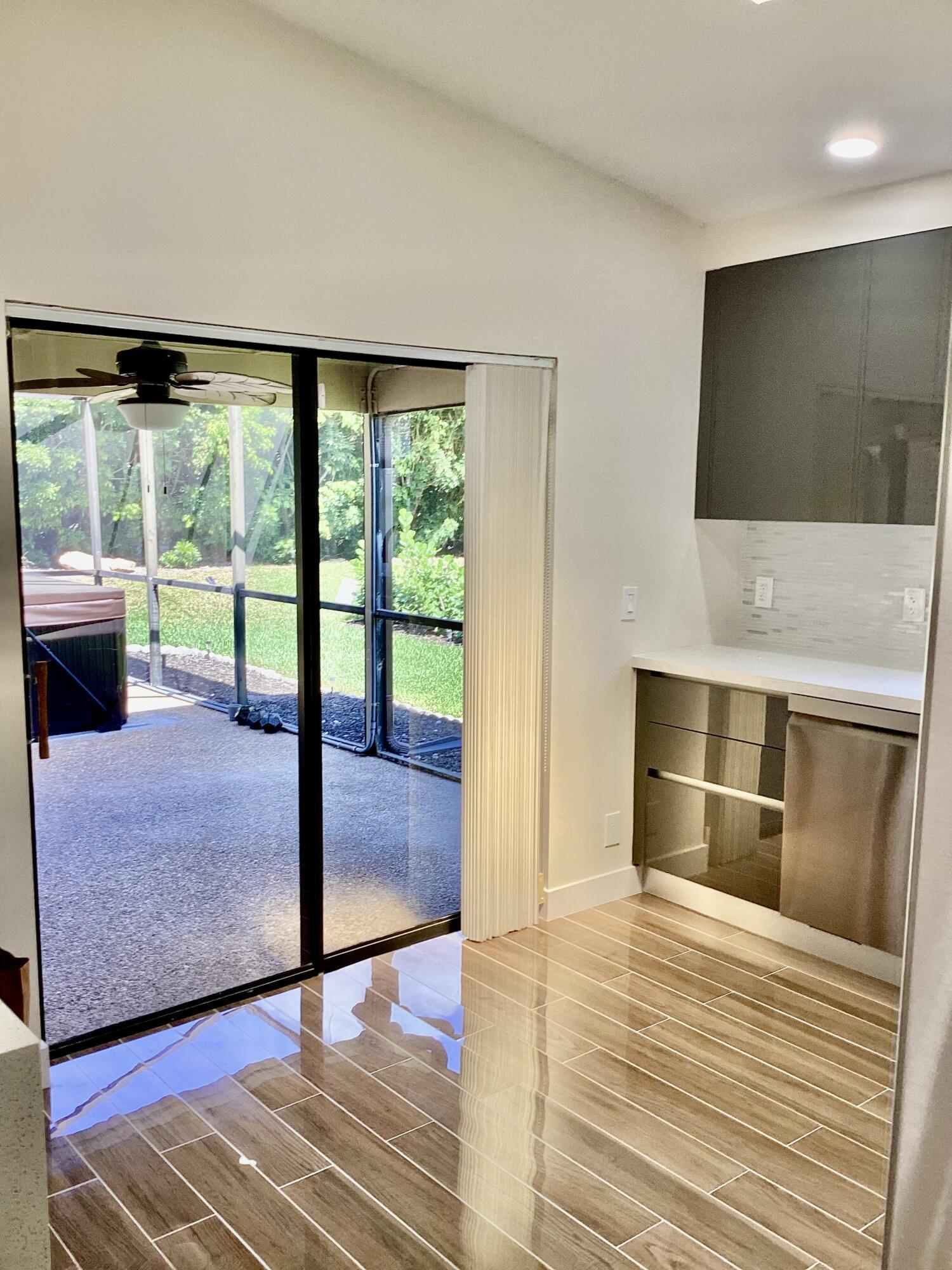 8895 Old Pine Road Boca Raton, FL 33433 - Photo 14 of 46 KITCHEN SLIDER DOOR