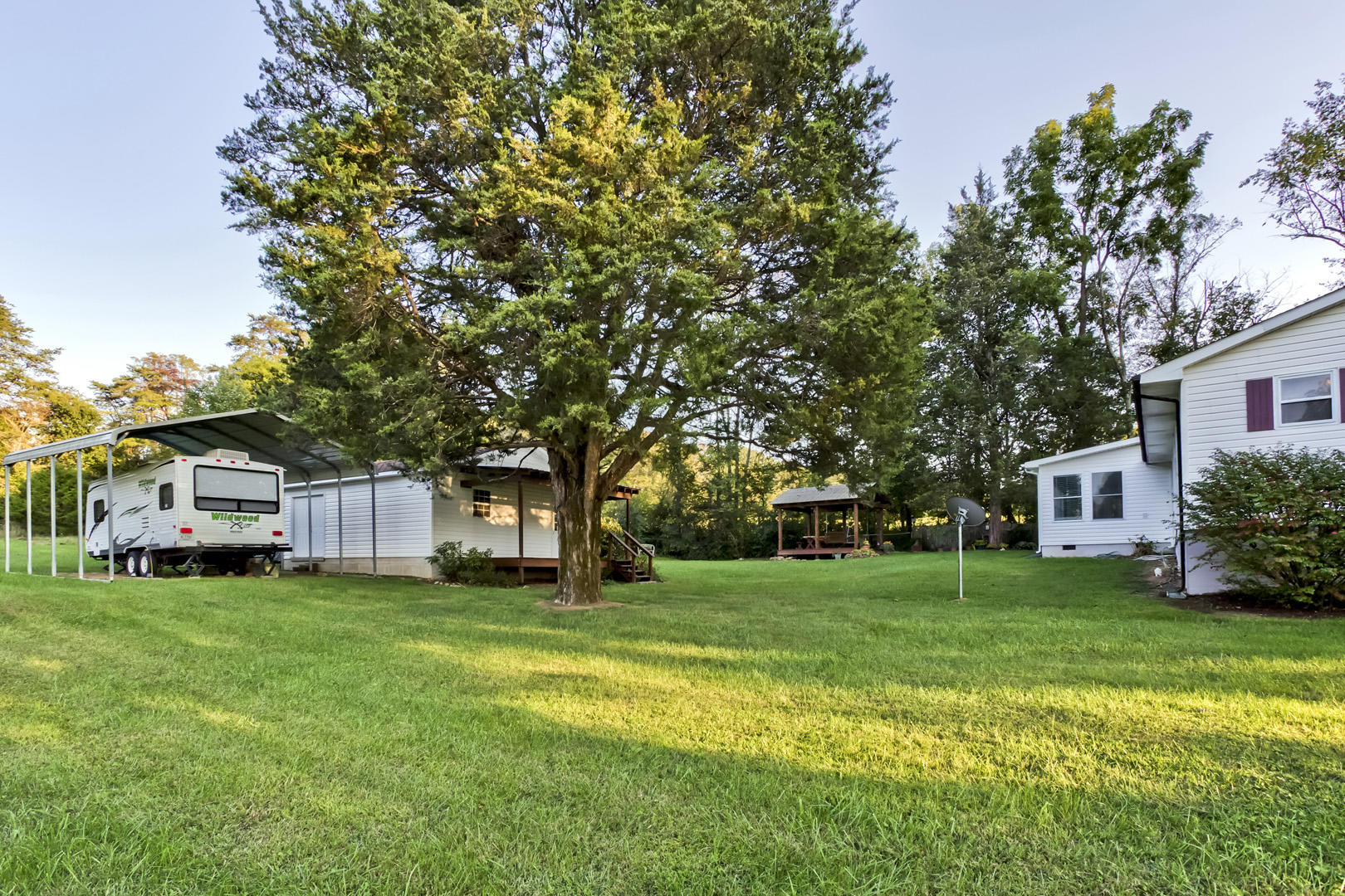 1420 Adams Road Strawberry Plains, TN 37871 - Photo 32 of 36 32_AdamsRoad_1420_SideYard