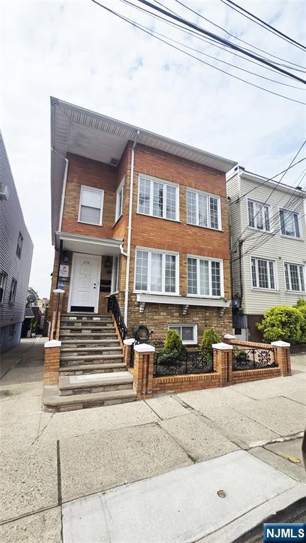 376 Delano Place, Unit 2 Fairview, NJ 07022 - Photo 1 of 21 a front view of a residential apartment building with a street