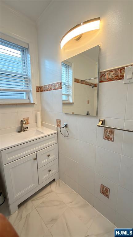 376 Delano Place, Unit 2 Fairview, NJ 07022 - Photo 13 of 21 a bathroom with a granite countertop sink mirror and vanity