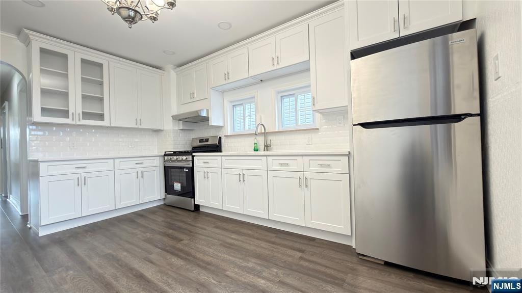 376 Delano Place, Unit 2 Fairview, NJ 07022 - Photo 15 of 21 a kitchen with white cabinets and white appliances