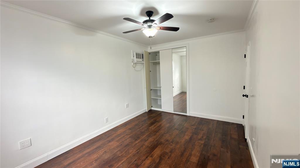 376 Delano Place, Unit 2 Fairview, NJ 07022 - Photo 20 of 21 a view of an empty room with wooden floor