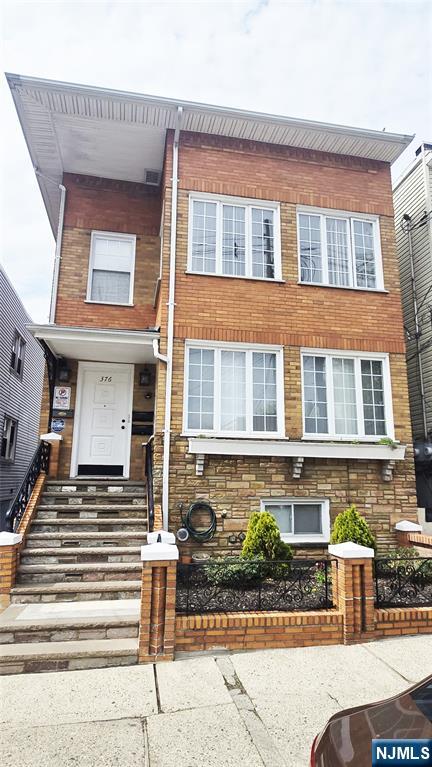 376 Delano Place, Unit 2 Fairview, NJ 07022 - Photo 2 of 21 a front view of a multi story building