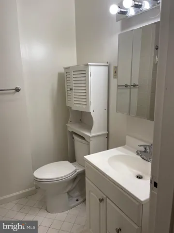 a bathroom with a toilet sink and shower