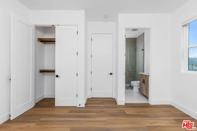 a view of wooden door and entryway in a room