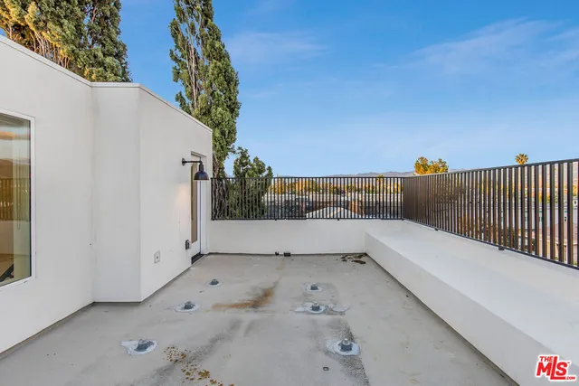 a view of a brick house with many windows
