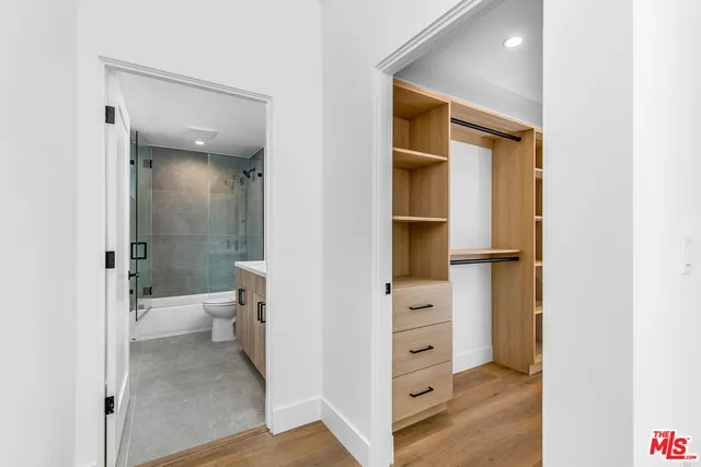 a bathroom with a toilet shower and a sink