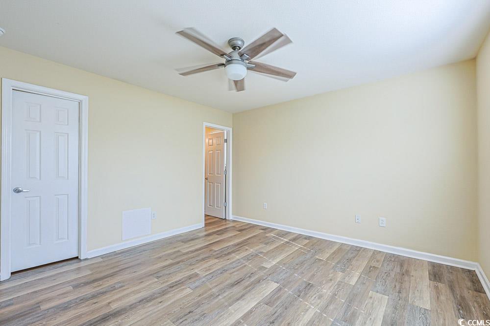 833 Silvercrest Drive Myrtle Beach, SC 29579 - Photo 11 of 30 Unfurnished bedroom featuring light wood finished floors and ceiling fan