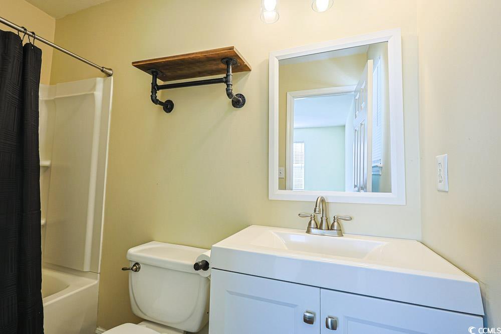 833 Silvercrest Drive Myrtle Beach, SC 29579 - Photo 14 of 30 Bathroom with shower / tub combo with curtain and vanity
