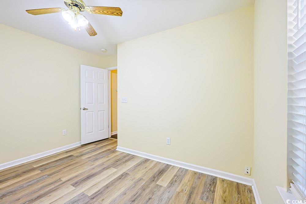 833 Silvercrest Drive Myrtle Beach, SC 29579 - Photo 15 of 30 Spare room with light wood-type flooring and ceiling fan