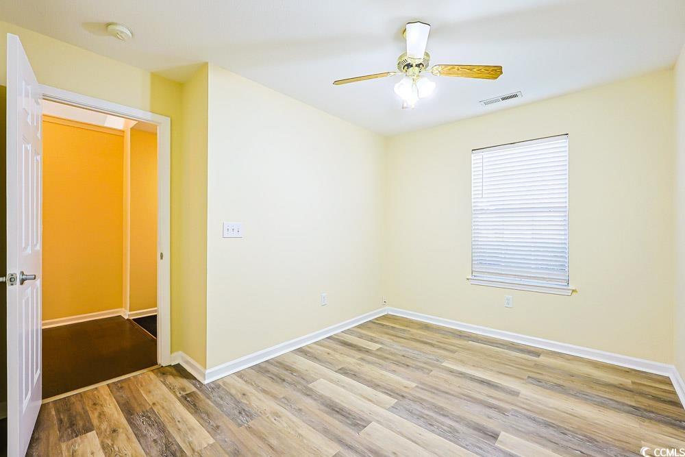 833 Silvercrest Drive Myrtle Beach, SC 29579 - Photo 16 of 30 Empty room with light wood-style floors and a ceiling fan